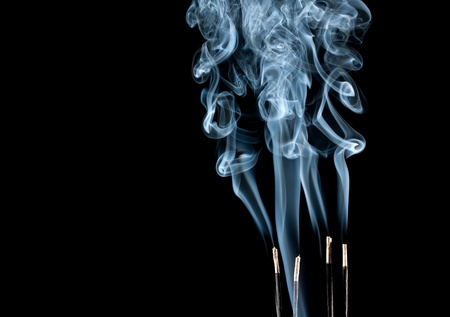 Abstract blue smoke waves from aroma sticksの写真素材