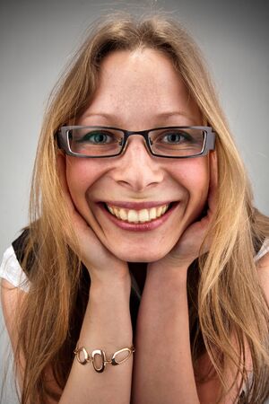 Portrait of beautiful smiling woman in glassesの写真素材