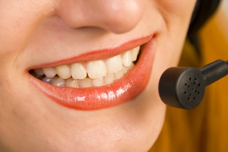 Operator of a call center or customer service closeup isolated on whiteの写真素材