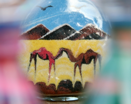 Two camels in Egypt desert. Sand in glass bottleの写真素材