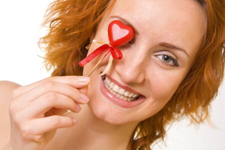 Smiling woman with red heartの写真素材