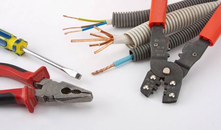 Electrician's tools. Pliers, cables, cutter and screwdriver