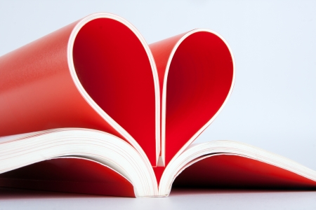 Close-up of book pages folded into a heart shapeの写真素材