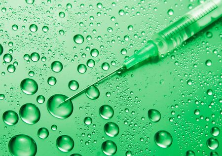 Medical syringe. First aid. Toned in greenの写真素材