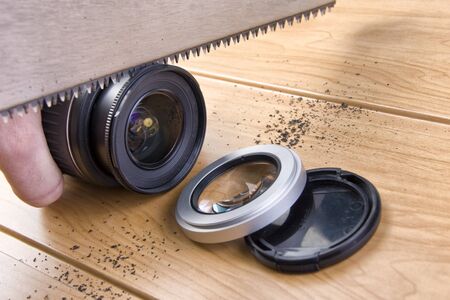Photographer saws a lens