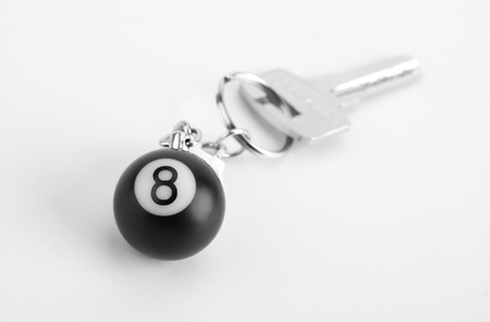 Close-up of small 8-ball on key ring