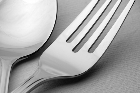 Close-up of fork and spoon on the tableの写真素材