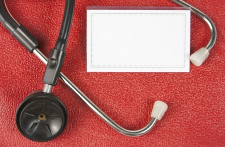 Close-up of stethoscope and blank business cardの写真素材