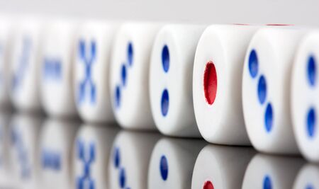 Row of gambling dices. Focus on red oneの写真素材