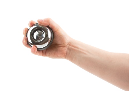 Gyroscope in hand. Isolated on white backgroundの写真素材