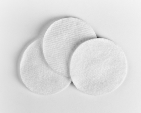Three white hygienic cotton disks
