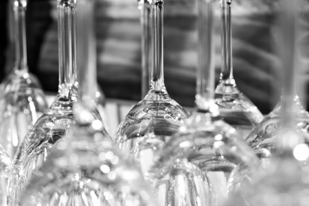 Wineglasses in rack. In B/Wの写真素材