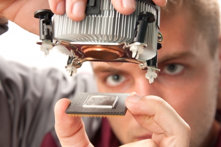 Computer support engineer installing processorの写真素材