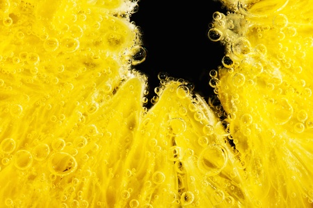 Close-up of a wet juicy orange sliceの写真素材