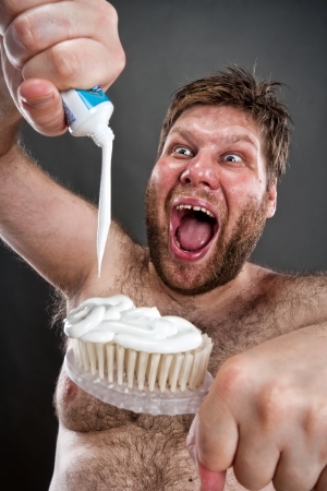 Ugly man preparing to brushing teethの写真素材