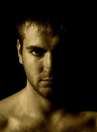 Sepia portrait of very serious manの写真素材