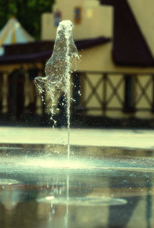 Water stream splashing on groundの写真素材