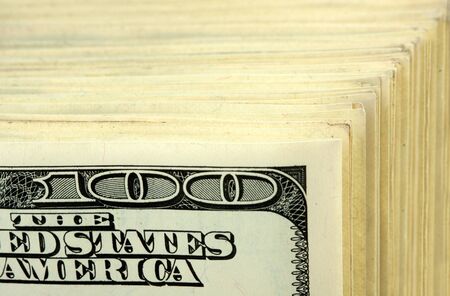 Big stack of $100 banknotes. Close-up view