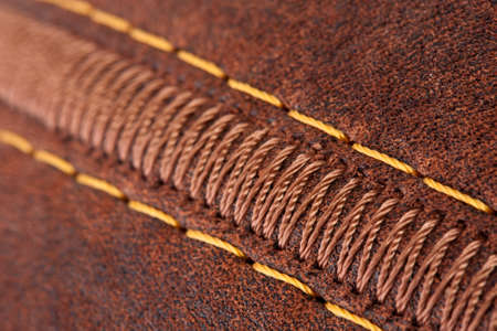 Close-up of thread seam on leather briefcaseの写真素材