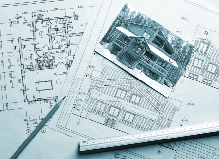 Architectural project of wooden mansion. Work drawings and photo on the tableの写真素材