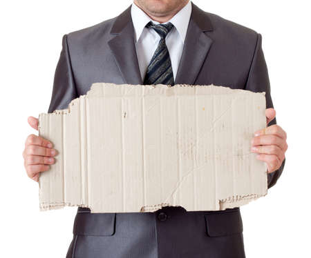 Fired businessman with messy cardboard frame. Isolated on whiteの写真素材