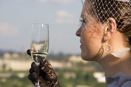 Retro woman with wineglass outdoorsの写真素材