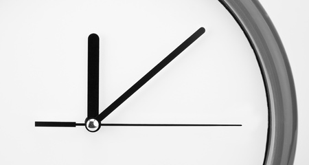 Close-up view of clock face. Time passing
