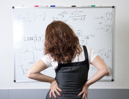 Student at blackboard in classroomの写真素材