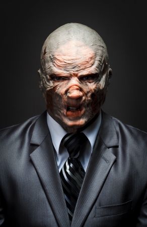 Angry monster in business suitの写真素材