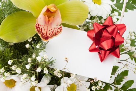 Bouquet of flowers with attached gift cardの写真素材