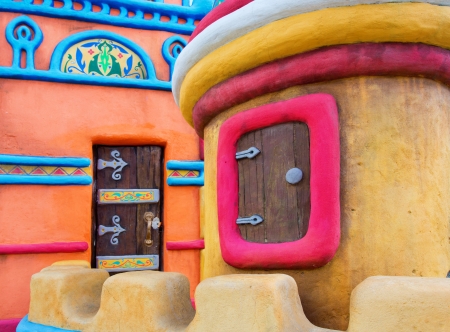 Fairy-tale colorful castle with small window and doorの写真素材