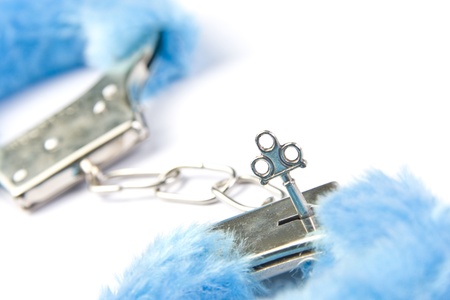 Blue fluffy handcuffs with keyの写真素材