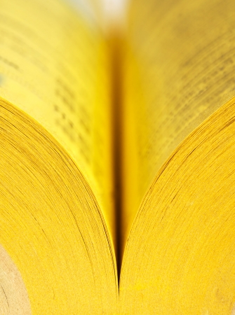 Close-up view of open yellow pages bookの写真素材