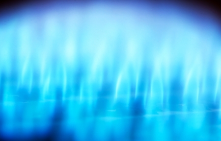 Close-up view of blue flames in gas boiler