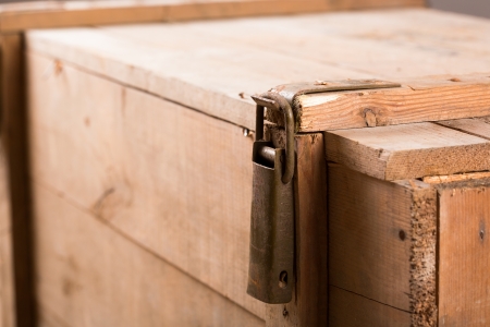 Closeup of metal latch on old wooden chestの写真素材