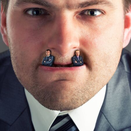 Businessman predator - businessmen instead of fangsの写真素材