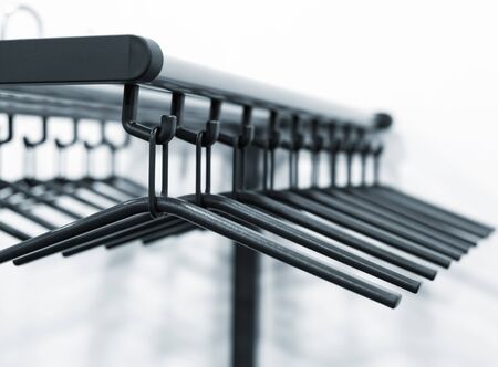 Empty clothes hangers in a row