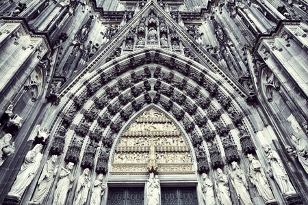 The cathedral of Cologne. Sandstone figures of saints from above the entranceの写真素材