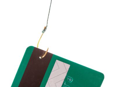 Closeup of a credit card caught on a fishing hookの写真素材