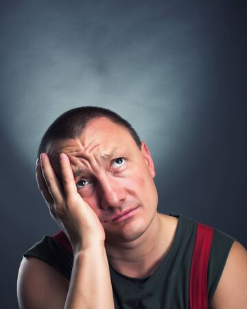 Portrait of sad man looking upの写真素材