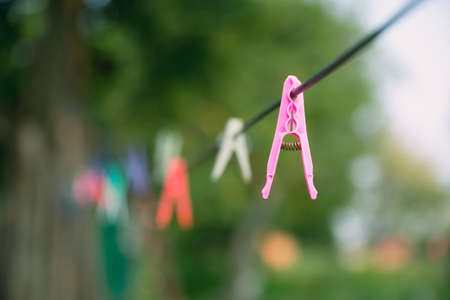 Colorful clothespins on a lineの写真素材