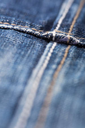 Closeup of seam on blue jeansの写真素材