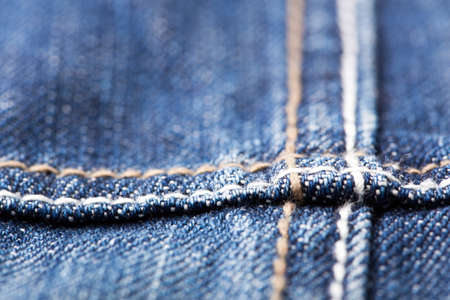 Closeup of seam on blue jeansの写真素材