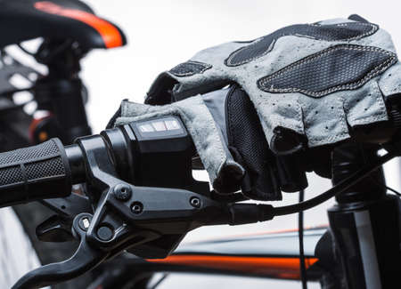 Race gloves on bicycle handlebar