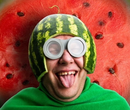 Funny man with watermelon helmet and googles looks like a parasitic caterpillarの写真素材