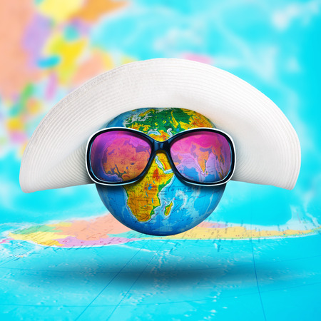 Closeup of globe with hat and pink sunglasses