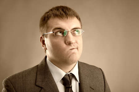 Young man in a suit looking upの写真素材