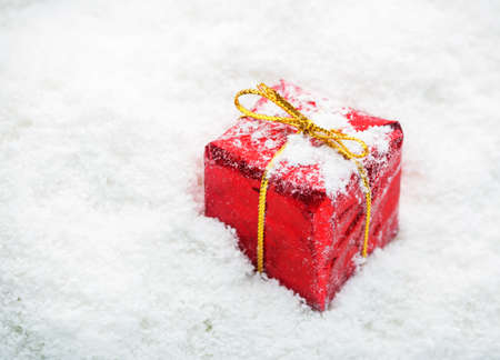 Red gift boxes with white snow shotの写真素材