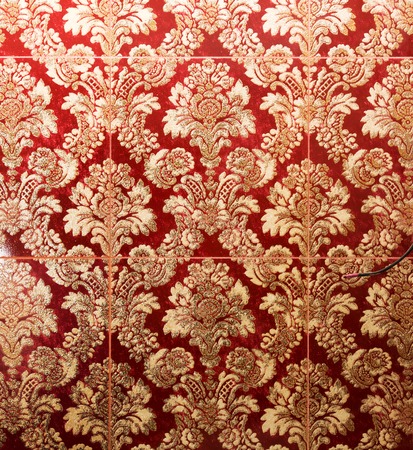 Ornamental vintage wallpaper in red and goldの写真素材