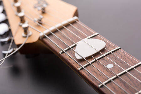 White pick in electric guitar strings